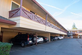 A parking garage with cars parked in it.
